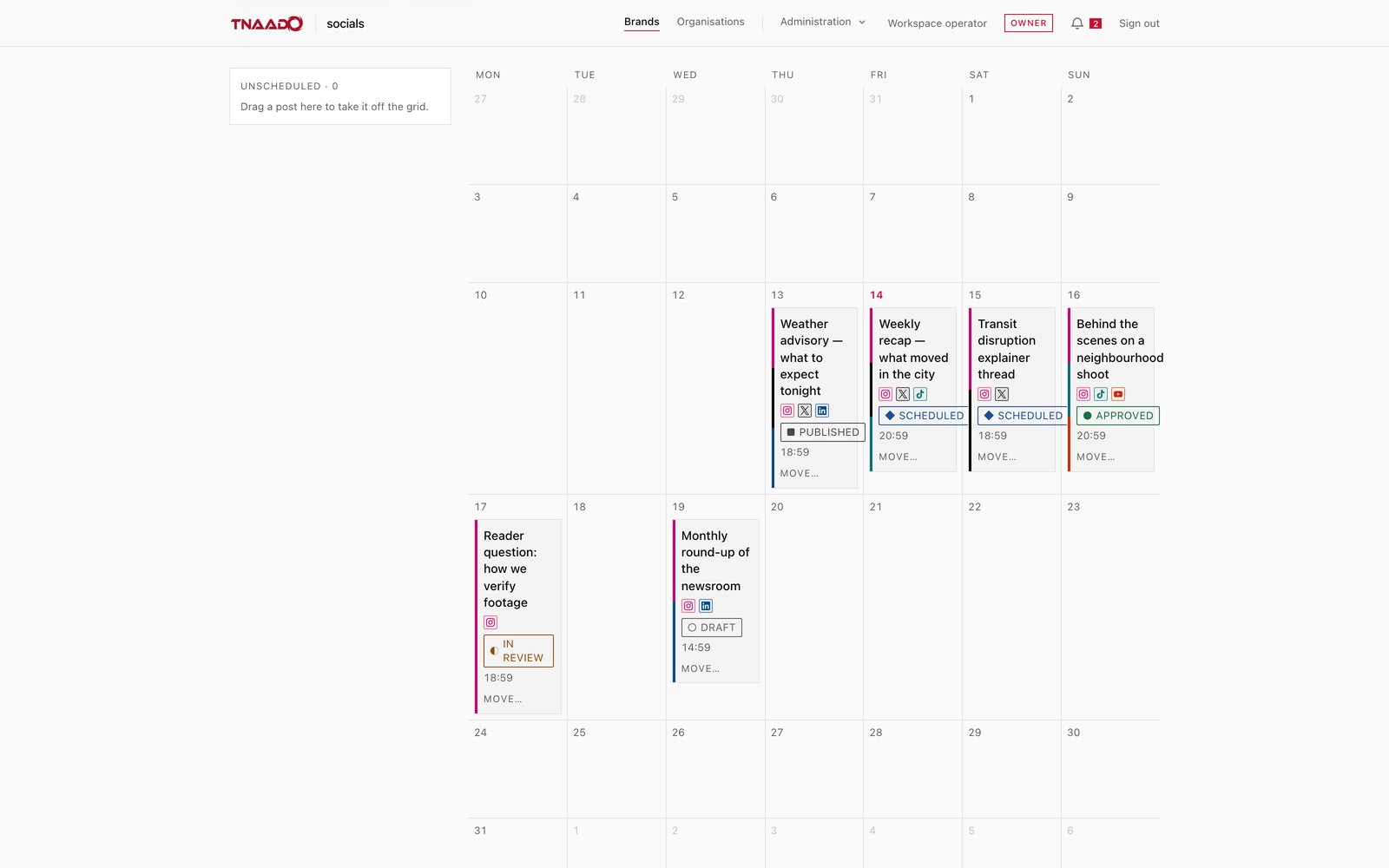 A month calendar with posts sitting on their dates, each card carrying its headline, small icons for the platforms it will go to, a state of draft, in review, approved, scheduled or published, and a time of day.